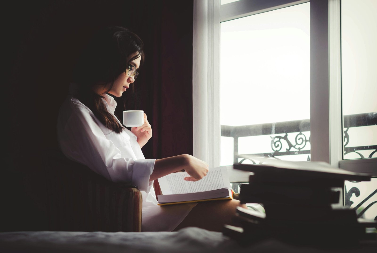 Peaceful reading corner with natural light and an open life-changing book