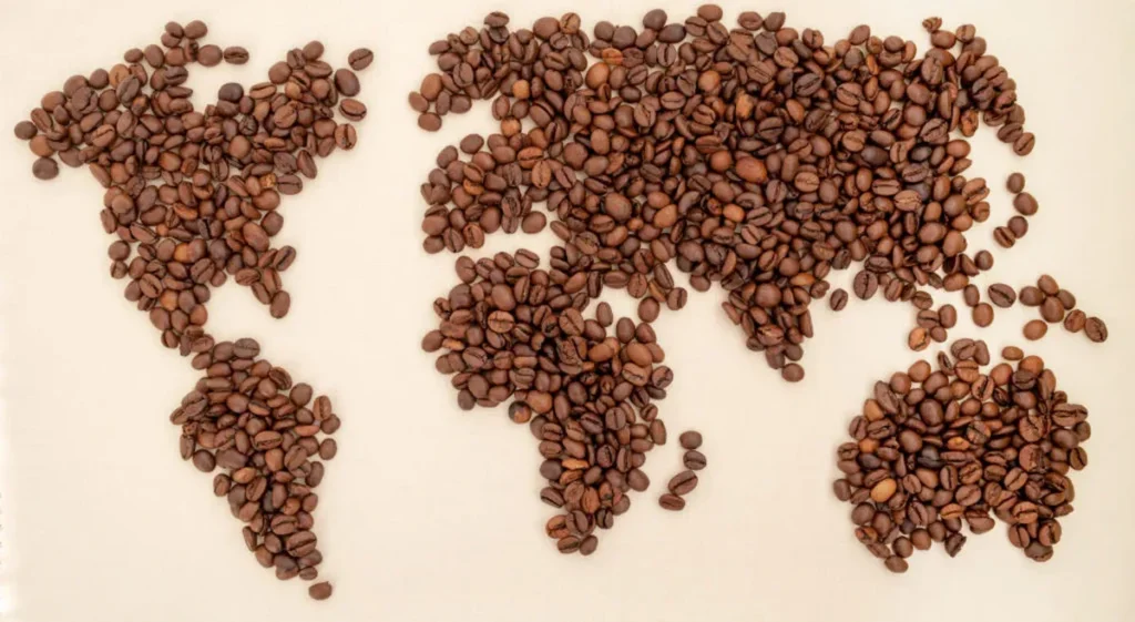 Coffee beans arranged in the shape of a world map, symbolizing coffee’s global influence.
