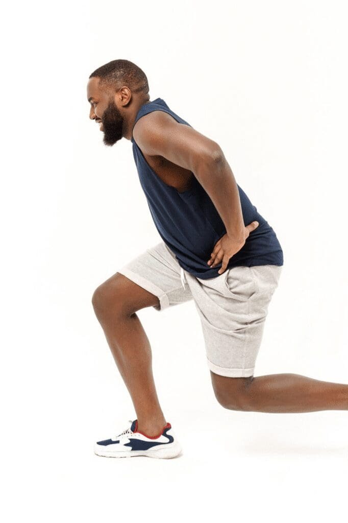 A man doing a hip hinge.