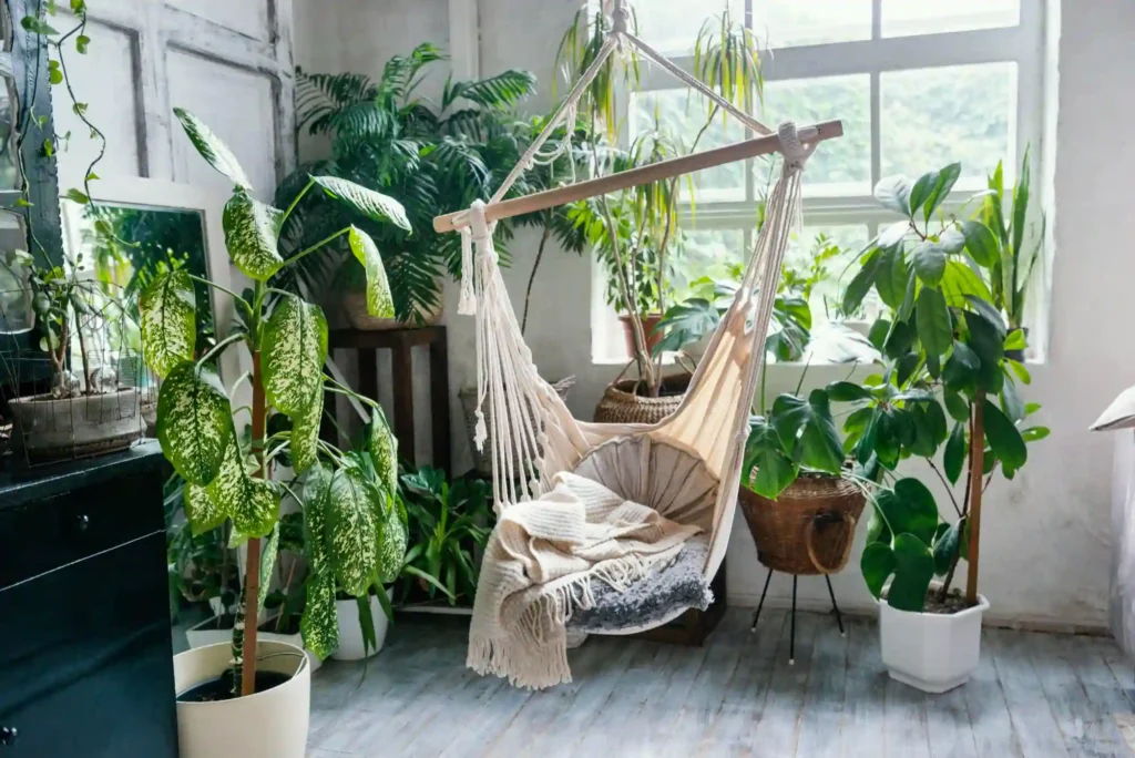 small bedroom design hacks with chair, blanket, plant, and wall decals